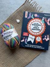 Laden Sie das Bild in den Galerie-Viewer, Woolly Hugs Sockenweltrekord signiertes Buch-Bundle